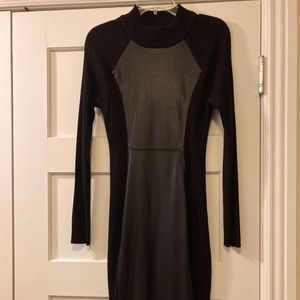 Black fitted sweater dress with faux leather front